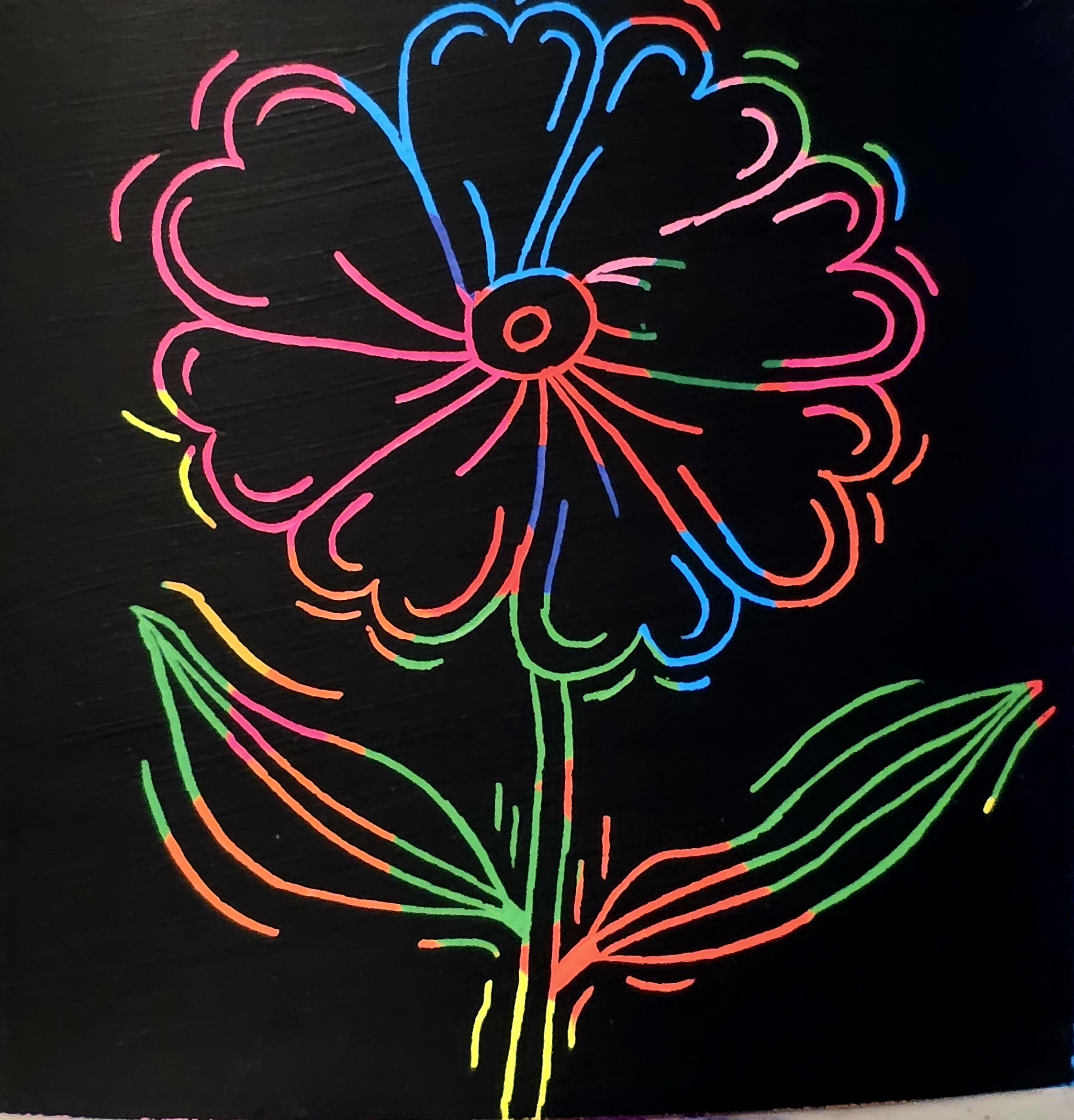 scratch art featuring a line art flower with bright, rainbow colors.
